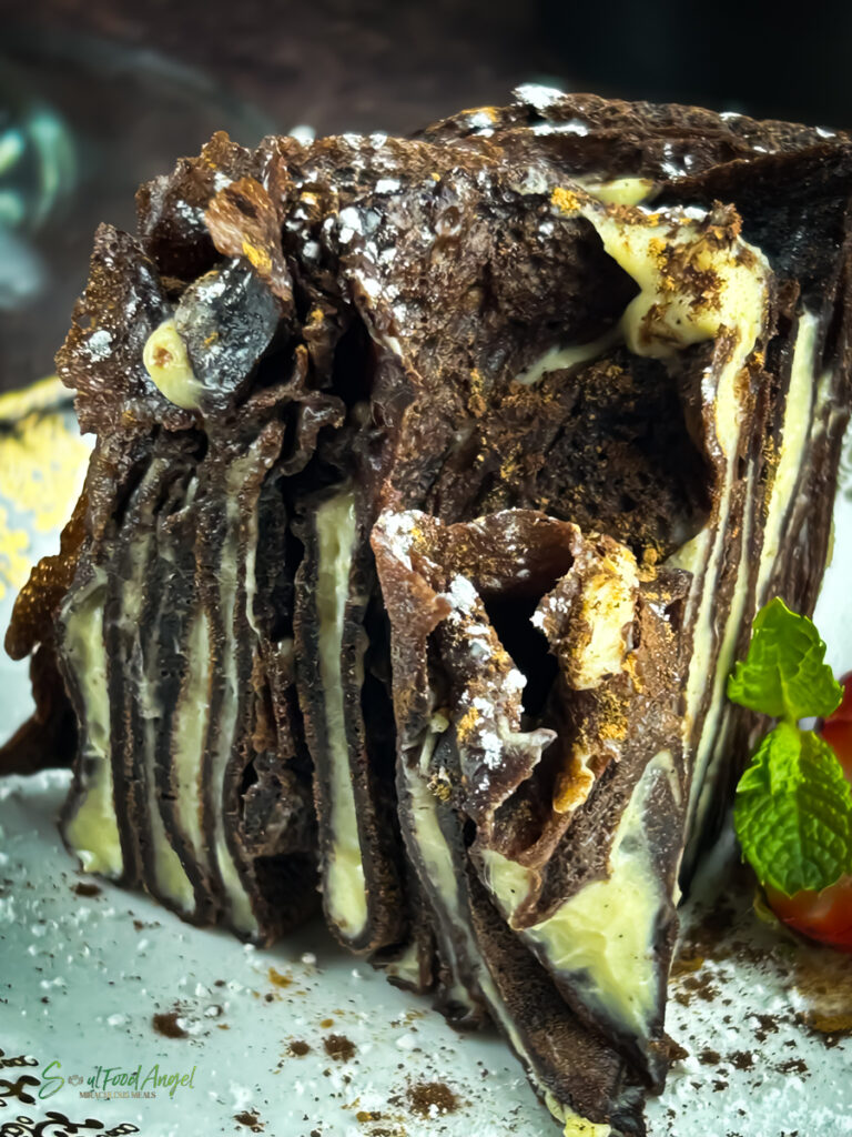 Chocolate Almond Crepe Cake recipe, cut and served, close up