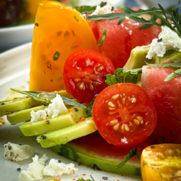 Tomato watermelon salad with harissa vinaigrette, close up