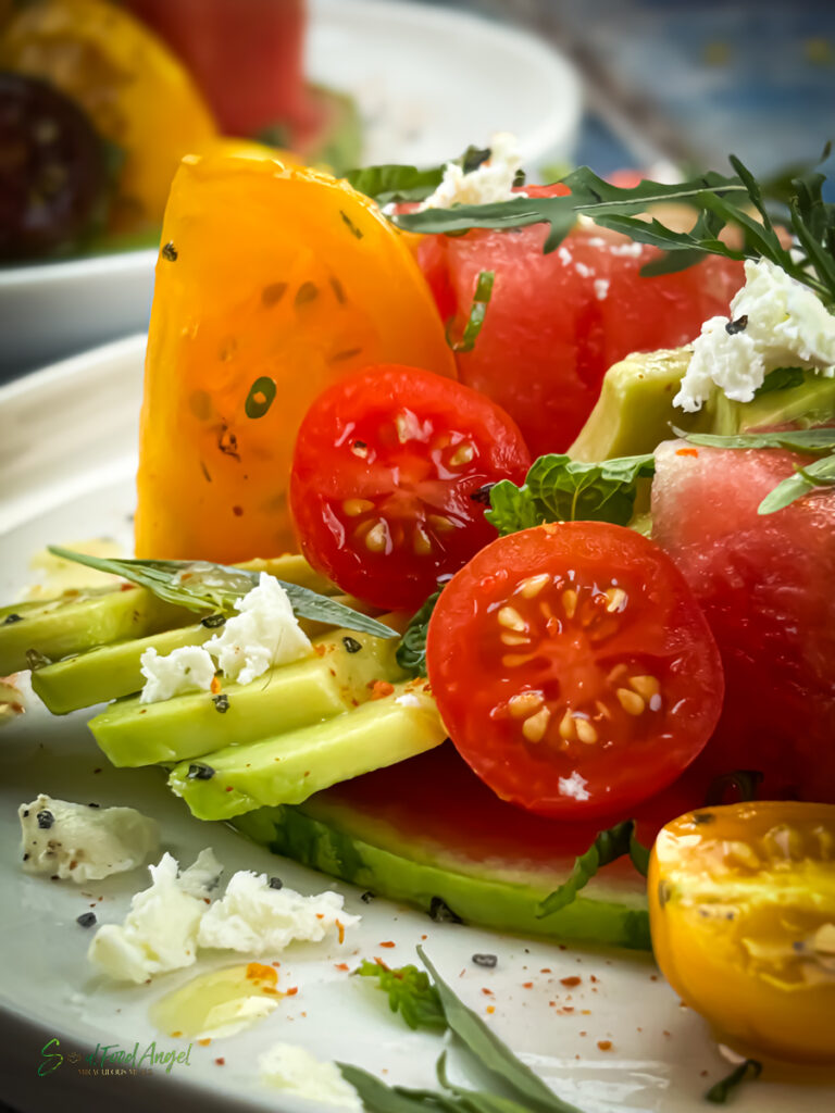 Tomato watermelon salad with harissa vinaigrette, close up